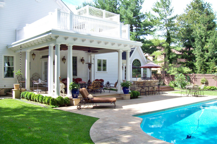 Pool pavilion with white columns and covered outdoor seating