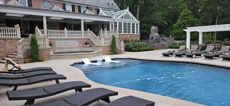 Estate pool with stone fireplace, pergola, and tiered balustrade terrace